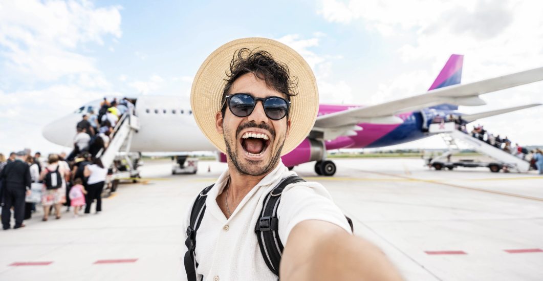 happy-tourist-boarding-on-a-plane-at-the-airport-2025-02-11-13-26-41-utc